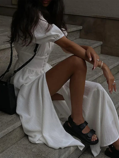 Abito lungo con maniche a bolla e bottoni stile francese